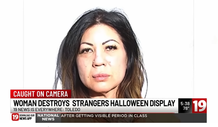 Mugshot of woman arrested for destroying Halloween lawn decorations